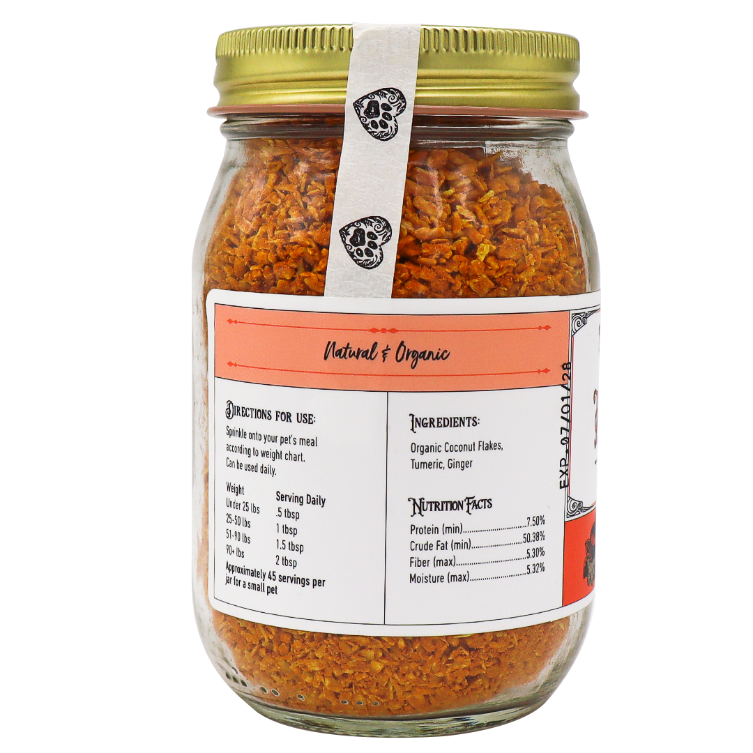 Project Sudz | Hip & Joint Support for Dogs and Cats - 210g comes in a glass jar with a gold lid, filled with orange flakes. The label features ingredients (coconut, turmeric, ginger), nutrition facts, and directions for pet use. Prominently marked as Natural & Organic, this hip & joint formula harnesses the power of turmeric to help support overall mobility in dogs and cats.