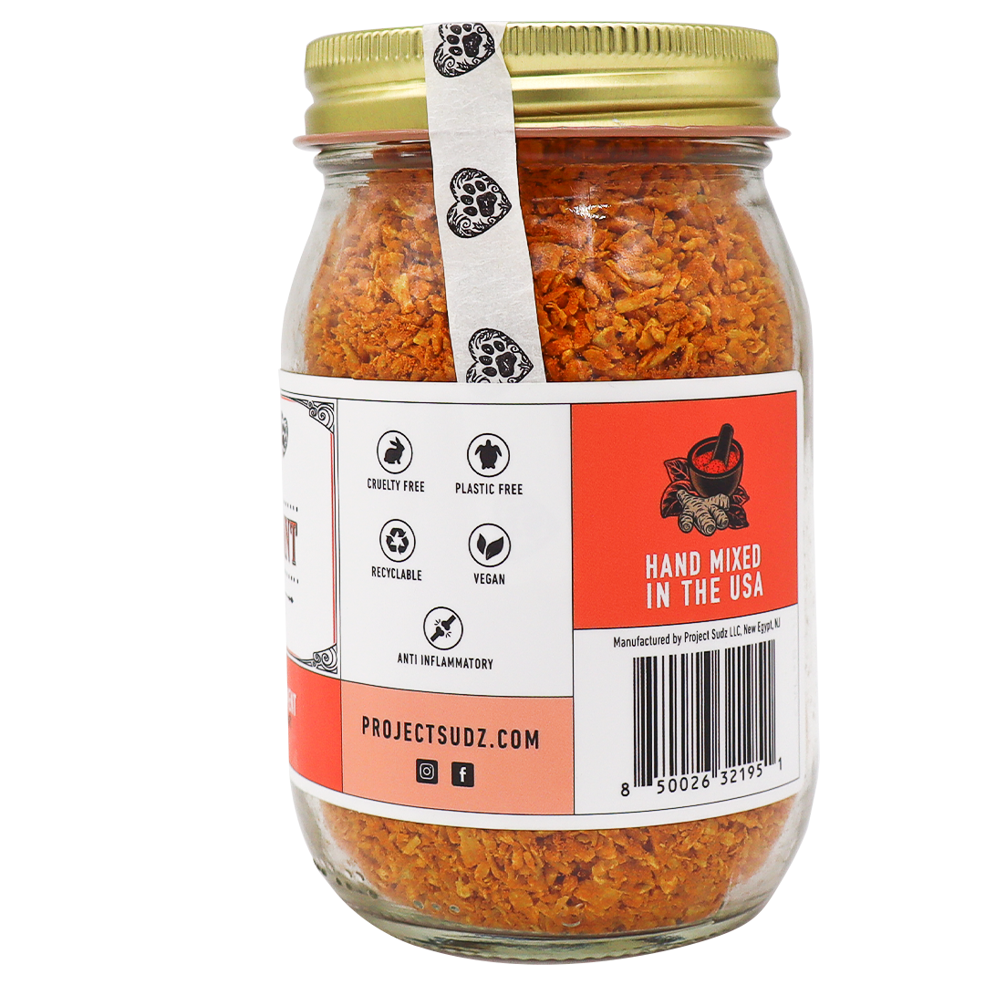 Project Sudz | Hip & Joint Support for Dogs and Cats - 210g comes in a glass jar with an orange herbal blend, topped with a gold lid. The label highlights that it’s cruelty-free, plastic-free, recyclable, vegan, and anti-inflammatory—making it the perfect turmeric supplement for pets’ hip & joint care. Hand mixed in the USA.