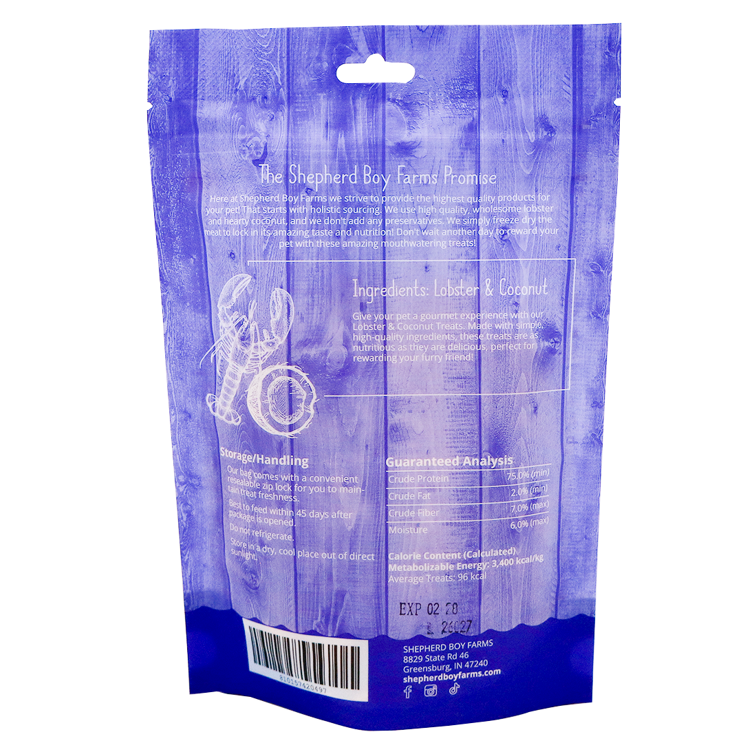 Back of a blue Shepherd Boy Farms | Freeze-Dried Lobster & Coconut Treats - 2oz bag, featuring high-protein freeze-dried lobster and organic coconut, storage tips, guaranteed analysis, expiration date, and company contact details.