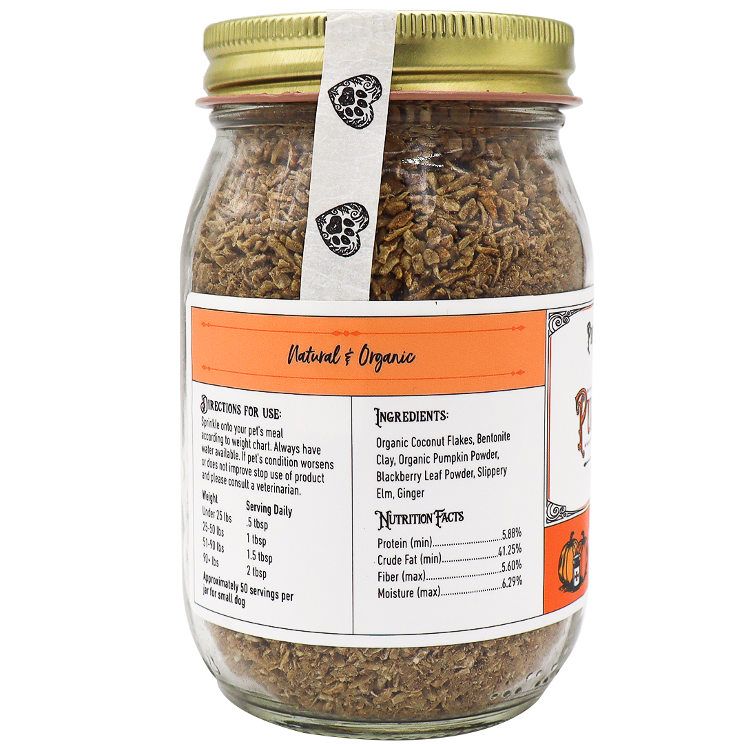 A glass jar with a gold lid contains Project Sudz | Pumpkin Rx GI Support for Dogs - 220g, a brown flaky product formulated to support healthy gut function in dogs. The label displays ingredients, nutrition facts, and directions for use and features “Natural & Organic” in orange text on the front.