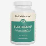 A white bottle labeled Real Mushrooms | 5 Defenders™ Organic Mushroom Blend Capsules for Humans - 90 Count features a teal and cream-colored label, emphasizing this potent mushroom complex that is expertly formulated to support immune health with high-quality functional mushrooms.
