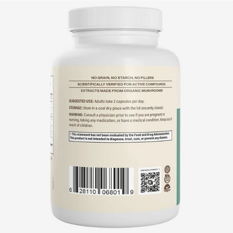 A white supplement bottle labeled with usage instructions, a barcode, and warnings. The text indicates it contains Real Mushrooms | 5 Defenders™ Organic Mushroom Blend Capsules for Humans (90 count), formulated for immune support, and advises taking two capsules daily.