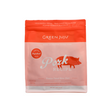 A red and white pouch of Green Juju | Freeze Dried Complete Raw Diet for pets, featuring a pig graphic, labeled as limited-ingredient and made with pasture-raised pork.