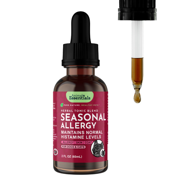 A bottle labeled “Animal Essentials | Seasonal Allergy Herbal Tonic - 2oz” for dogs and cats sits beside a dropper releasing a brown liquid. This tonic is designed to provide pet allergy relief, support normal histamine levels, and offer natural immune support for your furry companions.