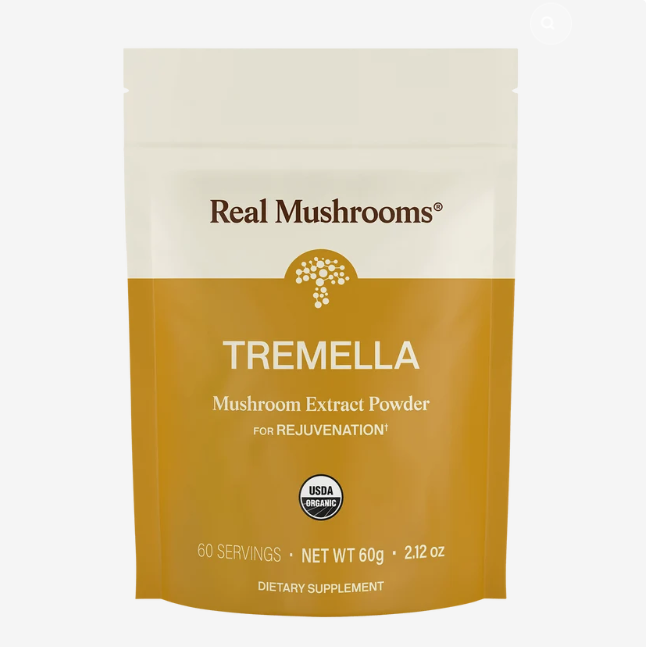 A yellow and white pouch labeled “Real Mushrooms | Organic Tremella Extract Powder – 60g” highlights its rejuvenation benefits, features 60 servings, is USDA Organic certified, and serves as a dietary supplement made with premium organic mushroom extract rich in beta-glucans for optimal wellness.