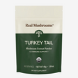 A 45g package of Real Mushrooms | Organic Turkey Tail Extract Powder, USDA organic, formulated for immune support and rich in beta-glucans, provides 45 servings and is presented in green and cream packaging.