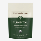 A 45g package of Real Mushrooms | Organic Turkey Tail Extract Powder, USDA organic, formulated for immune support and rich in beta-glucans, provides 45 servings and is presented in green and cream packaging.