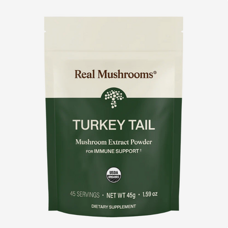 A 45g package of Real Mushrooms | Organic Turkey Tail Extract Powder, USDA organic, formulated for immune support and rich in beta-glucans, provides 45 servings and is presented in green and cream packaging.