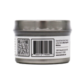 A silver tin can with a barcode, QR code, and printed text on its label. The text provides sourcing and packaging details along with a company address in Florida, USA. Specially designed for pet wellness, this product is labeled as Woof Creek | Ashwagandha Root Extract Powder for Dogs + Cats—a stress relief supplement for dogs and cats.