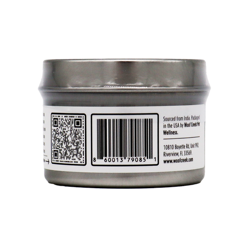 A silver tin can with a barcode, QR code, and printed text on its label. The text provides sourcing and packaging details along with a company address in Florida, USA. Specially designed for pet wellness, this product is labeled as Woof Creek | Ashwagandha Root Extract Powder for Dogs + Cats—a stress relief supplement for dogs and cats.