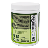 White plastic jar of Dog Greens- Organic and Wild Harvested Vitamin and Mineral Supplement for Dogs, featuring a green label with descriptions, ingredients, and a plant-based vitamin and mineral blend.