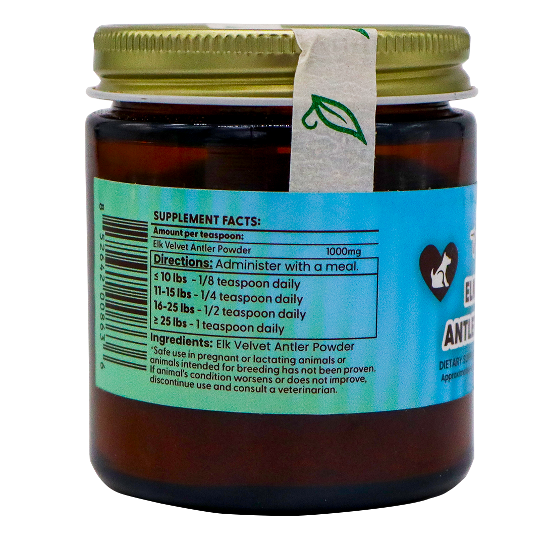 Dr. Judy's Elk Velvet Antler Powder - 30g comes in a brown jar with a gold lid, featuring a blue label that displays supplement facts and dosage instructions. The product is known for its IGF-1 content and provides joint support for dogs and cats. A small leaf-patterned seal crosses both the lid and the label.