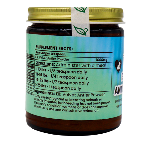 A 70g jar of Dr. Judy's Elk Velvet Antler Powder for Equines & Large Dogs features a green label displaying supplement facts, usage directions by pet weight, ingredients, and safety information. Designed as a joint support supplement to enhance dog mobility, the jar is topped with a gold lid and an attached seal adorned with leaf icons.