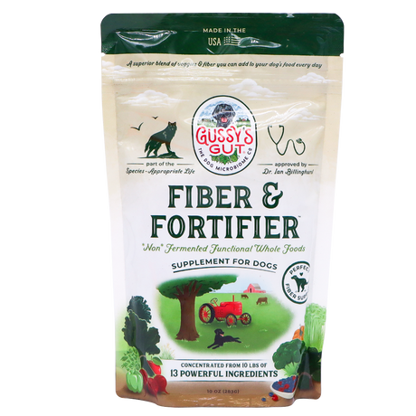 A beige 10oz bag of Gussy’s Gut | Fiber & Fortifier for Dogs features illustrations of a cat, dog, tractor, vegetables, and a farm scene. The packaging highlights its whole-food fiber blend and describes its benefits as a natural fiber supplement supporting optimal gut health in dogs.