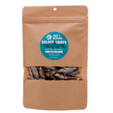 A brown resealable pouch with a clear window displays freeze-dried minnows inside. The label reads Woof Creek Golden Shiner Minnows | 1.5oz Pouch for Dogs + Cats. These nutritious morsels are perfect as dog treats or cat treats and make an excellent healthy reward for training.