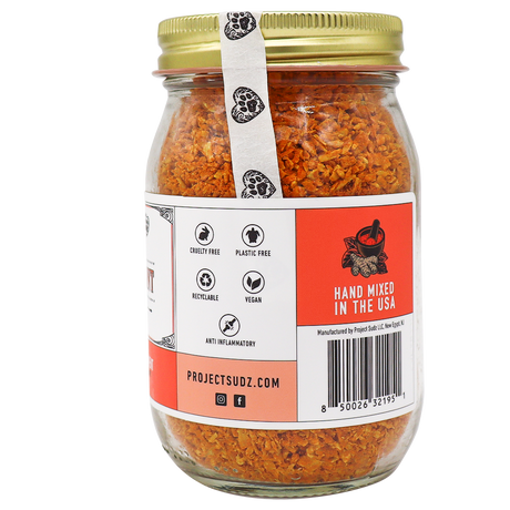 Project Sudz | Hip & Joint Support for Dogs and Cats - 210g comes in a glass jar with an orange herbal blend, topped with a gold lid. The label highlights that it’s cruelty-free, plastic-free, recyclable, vegan, and anti-inflammatory—making it the perfect turmeric supplement for pets’ hip & joint care. Hand mixed in the USA.
