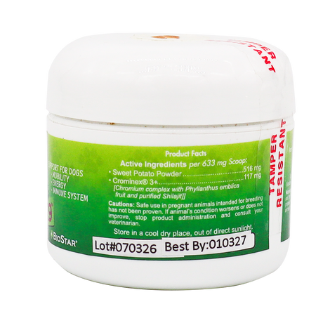 A white plastic container labeled “Biostar Garden Juvenate K9,” featuring a green and white design that displays supplement facts, caution information, lot number, best by date, and storage directions for a dog supplement.
