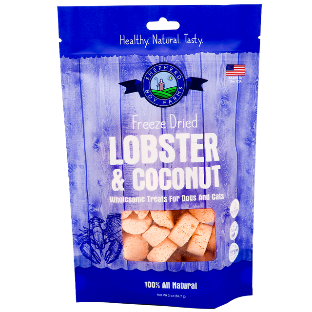 Shepherd Boy Farms | Freeze-Dried Lobster & Coconut Treats - 2oz features chunky lobster and organic coconut for dogs and cats in a blue and white bag. The packaging highlights “Healthy. Natural. Tasty.” and “100% All Natural.”.
