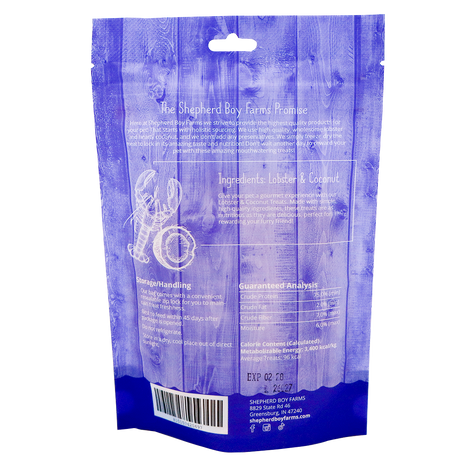 Back of a blue Shepherd Boy Farms | Freeze-Dried Lobster & Coconut Treats - 2oz bag, featuring high-protein freeze-dried lobster and organic coconut, storage tips, guaranteed analysis, expiration date, and company contact details.
