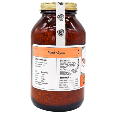 A large glass jar with a gold lid contains Project Sudz | Pumpkin Boost Digestive Health for Dogs and Cats - 210g, featuring a reddish-brown dried blend formulated to support pet digestive health. The label displays ingredients, directions, and nutrition facts, highlighting beneficial additions like slippery elm and soil-based probiotics. A white seal marked with black logos runs from the lid down the side of the jar.