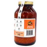 Project Sudz | Pumpkin Boost Digestive Health for Dogs and Cats - 210g comes in a large amber glass jar with a gold lid, containing dried orange contents designed to support your pet’s digestive health. The label displays icons for cruelty free, plastic free, moisture protection, and vegan. Next to a pumpkin illustration, text reads “Hand Mixed in the USA”—highlighting a blend of slippery elm and soil-based probiotics carefully crafted for your pet’s well-being.