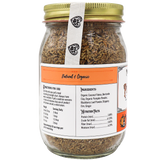 A glass jar with a gold lid contains Project Sudz | Pumpkin Rx GI Support for Dogs - 220g, a brown flaky product formulated to support healthy gut function in dogs. The label displays ingredients, nutrition facts, and directions for use and features “Natural & Organic” in orange text on the front.