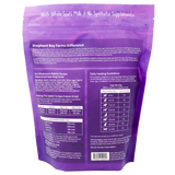 Back of a purple Shepherd Boy Farms | Freeze-Dried Rabbit Recipe for Dogs - 14oz package displaying product details, feeding guidelines by dog weight, ingredients list, and a Guaranteed Analysis nutrition chart. Text highlights With Whole Goat’s Milk | No Synthetic Supplements. Specially crafted as an organic, high protein dog food—ideal for those looking for premium rabbit dog food options.
