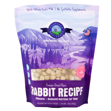 A 14 oz (397g) bag of Shepherd Boy Farms Freeze-Dried Rabbit Recipe for Dogs, featuring a purple design with a nature scene and deer, emphasizes goat’s milk and the absence of synthetic supplements. This high-protein, organic dog food provides wholesome nutrition for your pet.