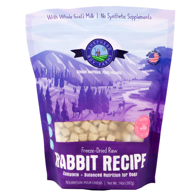 A 14 oz (397g) bag of Shepherd Boy Farms Freeze-Dried Rabbit Recipe for Dogs, featuring a purple design with a nature scene and deer, emphasizes goat’s milk and the absence of synthetic supplements. This high-protein, organic dog food provides wholesome nutrition for your pet.