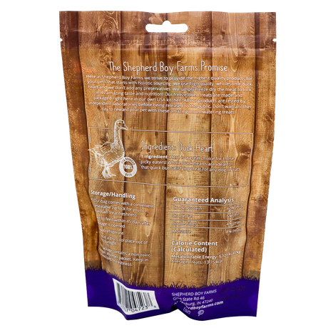 The back of the Shepherd Boy Farms Freeze-Dried Duck Hearts - 3oz bag displays a brand promise, high protein duck heart details, storage instructions, guaranteed analysis, calorie info, contact details, and features a wood-plank design.