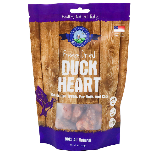 A 3oz bag of Shepherd Boy Farms Freeze-Dried Duck Hearts—single-ingredient, 100% all natural treats for dogs and cats—with a wood-grain design, product name, and a small window displaying the freeze-dried duck hearts inside.