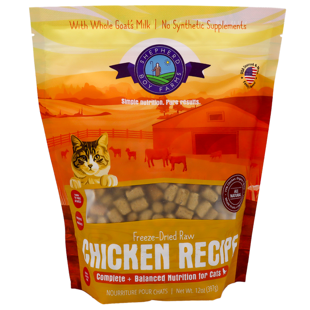 Certainly! Here’s the rewritten sentence using your product data: A 14oz bag of Shepherd Boy Farms Chicken Recipe for Cats showcases a farm-themed background, a playful cat illustration, and text promoting whole goat’s milk and natural ingredients—all combined in a tasty freeze-dried raw chicken recipe your feline will love.