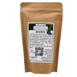 A 4oz stand-up pouch of Solutions Pet Products | Biome - 4oz gut microbiome supplement. The label shows a logo, wooden spoon with green powder, ingredients, QR code, and Packed On 8/29/26 stamp.