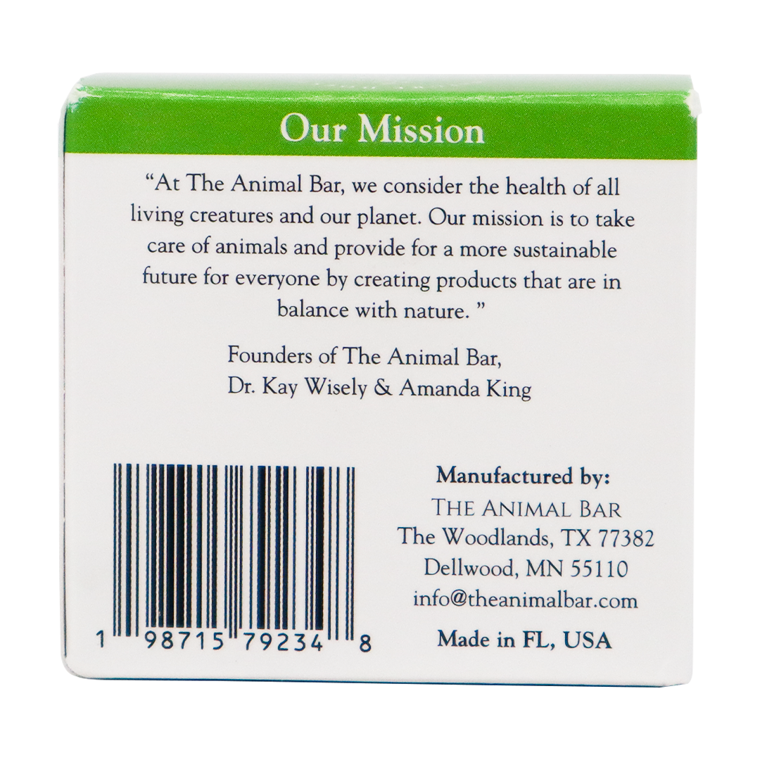 The back of The Animal Bar | Soothing Salve for Dogs & Cats - 2oz box features the brand’s mission statement about caring for animals and the planet, along with the founders’ names, a barcode, and contact information for the company in The Woodlands, TX.