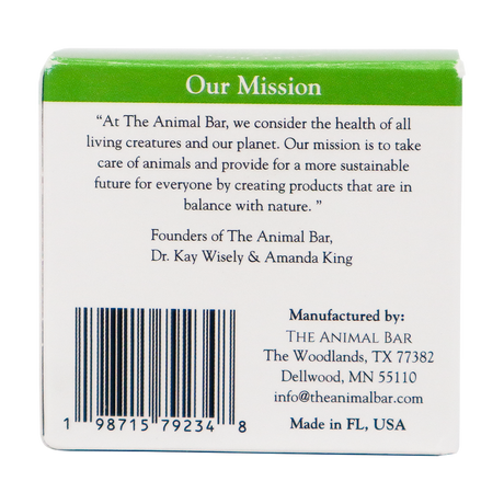 The back of The Animal Bar | Soothing Salve for Dogs & Cats - 2oz box features the brand’s mission statement about caring for animals and the planet, along with the founders’ names, a barcode, and contact information for the company in The Woodlands, TX.