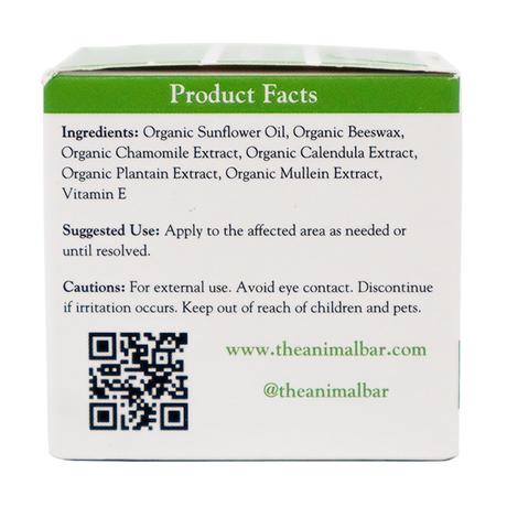 The box panel for The Animal Bar | Soothing Salve for Dogs & Cats – 2oz lists ingredients, suggested use, and cautions. It also features a QR code, website, and social media handle. Text appears in green and black on a white background.