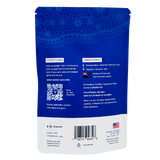The back of a blue, flat-bottomed pouch for Tvati | Advanced Pet Mobility Formula, showing directions, an ingredients list featuring hibiscus and coconut oil, a QR code, a barcode, and company contact information for pet mobility support.