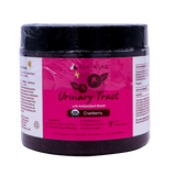 A jar of kin+kind Urinary Tract with Antioxidant Boost supplement for pets, featuring a cranberry flavor, comes in a pink and white label that displays its USDA organic certification and emphasizes its benefits for both dogs and cats. Vet-formulated, this top-tier organic pet supplement is designed to support optimal urinary tract health for your furry companions.