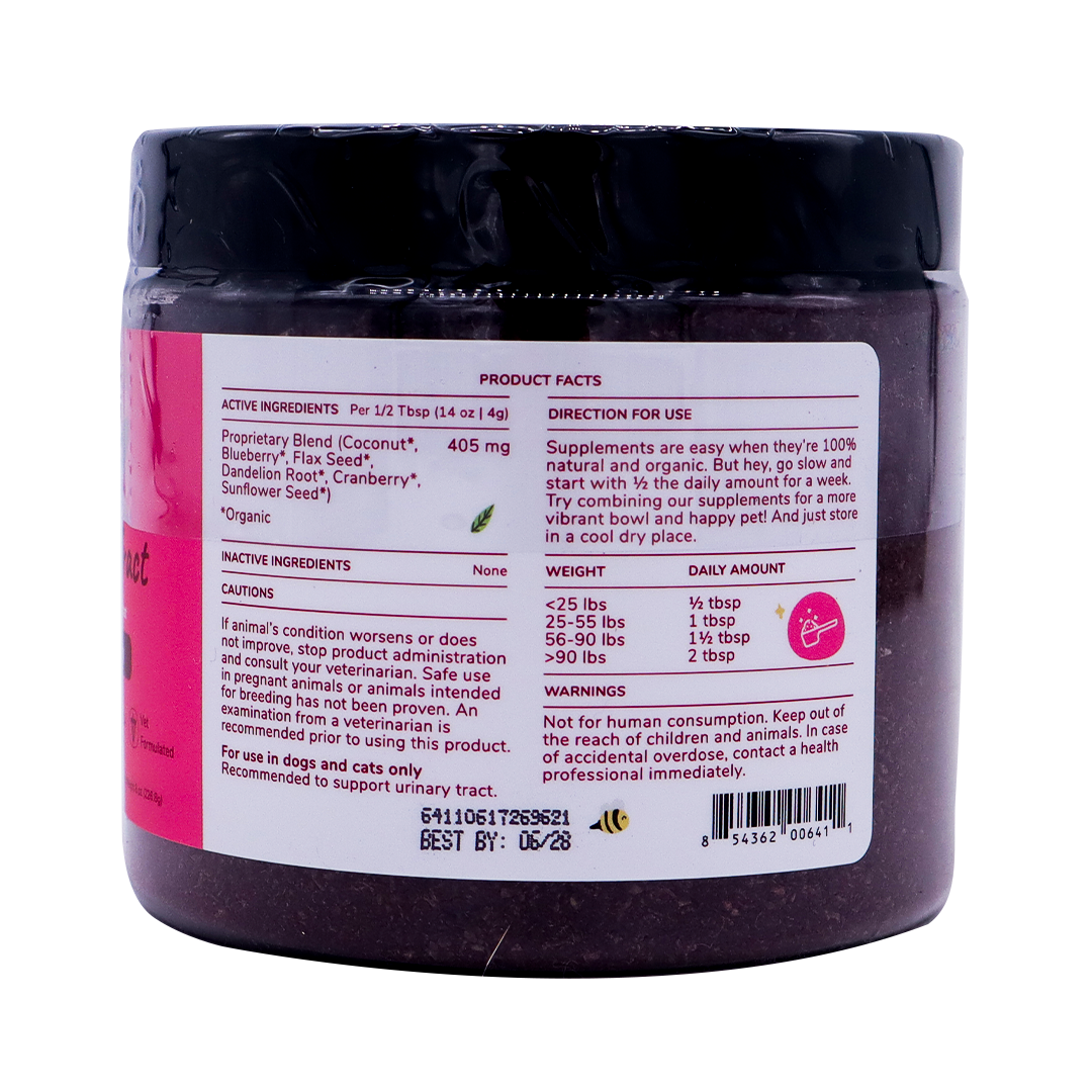 A close-up of the kin+kind Urinary Tract with Antioxidant Boost supplement jar label displays product facts, directions, active and inactive ingredients, a dosage chart by pet weight, caution statements, a barcode, and an expiration date. The jar is black with a white and pink label. Prominently featured on the label are USDA organic superfood supplements formulated for pets to support optimal urinary tract health.