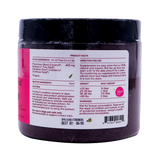 A close-up of the kin+kind Urinary Tract with Antioxidant Boost supplement jar label displays product facts, directions, active and inactive ingredients, a dosage chart by pet weight, caution statements, a barcode, and an expiration date. The jar is black with a white and pink label. Prominently featured on the label are USDA organic superfood supplements formulated for pets to support optimal urinary tract health.